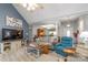Open-concept living space with a TV, comfortable sofas, and view into dining area at 2020 Olde Towne Dr, Monroe, NC 28110