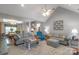 Open-concept living room with ample seating, a dining area, and plenty of natural light at 2020 Olde Towne Dr, Monroe, NC 28110