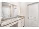 This bathroom features granite countertops, white cabinets, and an oversized mirror at 2030 Lanza Dr, Charlotte, NC 28215