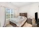 Bright bedroom with a large window, providing natural light and a view of the outdoors at 2030 Lanza Dr, Charlotte, NC 28215