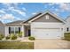 Beautiful home featuring neutral siding, white garage door and attractive, low maintenance landscaping at 2030 Lanza Dr, Charlotte, NC 28215