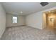Bright, spacious bedroom with large windows and neutral carpet, great natural light at 2206 Silverbell Ln, Stanley, NC 28164