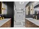 Modern bathroom featuring dual sinks, herringbone tile shower and marble floors at 222 Riverview Ter, Clover, SC 29710