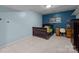 Cozy bedroom featuring a charming desk and crib in a partially finished basement at 222 Riverview Ter, Clover, SC 29710