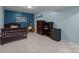 Cozy bedroom with tile flooring, a charming desk, and ample storage in a partially finished basement at 222 Riverview Ter, Clover, SC 29710