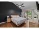 Modern bedroom with hardwood floors and a sliding glass door providing access to the deck at 222 Riverview Ter, Clover, SC 29710
