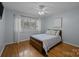 Bedroom with a queen-size bed, ceiling fan, hardwood floors, and a window at 222 Riverview Ter, Clover, SC 29710