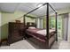 Bedroom featuring tile floors, a four-poster bed, and a sliding glass door to the exterior at 222 Riverview Ter, Clover, SC 29710