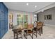 Elegant dining room with a large wooden table, modern decor, and sliding door enhances the entertaining space at 222 Riverview Ter, Clover, SC 29710