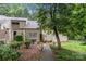 Charming townhome with mature trees and landscaping creates a serene setting and inviting curb appeal at 222 Riverview Ter, Clover, SC 29710