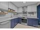 Kitchen with white backsplash and two-tone cabinets with open shelving and stainless range at 222 Riverview Ter, Clover, SC 29710