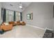 Bright living room featuring vaulted ceilings, large windows, and modern furnishings creates a welcoming atmosphere at 222 Riverview Ter, Clover, SC 29710
