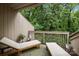 Relaxing patio area with lounge chairs overlooking a lush, wooded backyard at 222 Riverview Ter, Clover, SC 29710