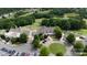 Aerial view of golf course, providing a glimpse of lush fairways, greens, and the club house at 27037 Tidal Way, Tega Cay, SC 29708
