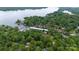 Scenic aerial view of lakefront community with boat docks nestled in dense forest at 27037 Tidal Way, Tega Cay, SC 29708