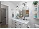 Bathroom featuring double sinks with modern fixtures, marble countertops and charming decor at 27037 Tidal Way, Tega Cay, SC 29708