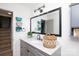 Well lit bathroom with granite countertops, framed mirror, and stylish decorations at 27037 Tidal Way, Tega Cay, SC 29708
