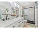 Modern bathroom with a double sink vanity, black fixtures, and a glass enclosed shower at 27037 Tidal Way, Tega Cay, SC 29708