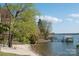 Scenic view of a sandy beach and lake with a covered dock perfect for Gathering enjoyment at 27037 Tidal Way, Tega Cay, SC 29708