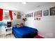 Vibrant bedroom featuring fun wall decor, comic theme and wood-look floors at 27037 Tidal Way, Tega Cay, SC 29708