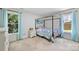 Bedroom featuring a canopy bed with fairy lights and large windows at 27037 Tidal Way, Tega Cay, SC 29708