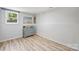 Bright bedroom with neutral tones, sleek floors, and minimalist decor at 27037 Tidal Way, Tega Cay, SC 29708