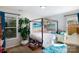 Bright bedroom with large window, plant, and canopy bed at 27037 Tidal Way, Tega Cay, SC 29708