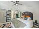 Bedroom featuring neutral tones, closet storage, a small plant, and natural light at 27037 Tidal Way, Tega Cay, SC 29708