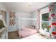 Charming bedroom featuring a unique bed frame and colorful curtains at 27037 Tidal Way, Tega Cay, SC 29708