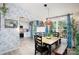 Cozy dining area with ample natural light, featuring stylish decor and an adjacent kitchen space at 27037 Tidal Way, Tega Cay, SC 29708