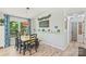 Comfortable dining room area featuring a dining table with a yellow runner and a sign on the wall at 27037 Tidal Way, Tega Cay, SC 29708