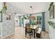 Dining area features decorative wall paper, blue curtains, and a view of the back yard at 27037 Tidal Way, Tega Cay, SC 29708
