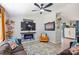 Cozy living room with a ceiling fan and an electric fireplace at 27037 Tidal Way, Tega Cay, SC 29708