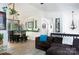 Open concept living room flowing into dining area with modern decor and laminate flooring at 27037 Tidal Way, Tega Cay, SC 29708