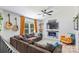 Spacious living room with a ceiling fan, guitars, and an electric fireplace at 27037 Tidal Way, Tega Cay, SC 29708