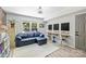 Inviting room with a blue sofa, work stations, and a large window view at 27037 Tidal Way, Tega Cay, SC 29708