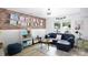 Inviting living room with exposed brick, comfortable seating, and a cozy atmosphere at 27037 Tidal Way, Tega Cay, SC 29708
