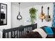 Stylish decor on the second floor landing area with hanging plants and electric guitars at 27037 Tidal Way, Tega Cay, SC 29708