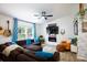 Cozy living room with a sectional sofa, a fireplace, and stylish decor at 27037 Tidal Way, Tega Cay, SC 29708