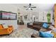 Spacious living room with a ceiling fan and an adjacent dining area at 27037 Tidal Way, Tega Cay, SC 29708