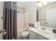 Clean bathroom with a shower-tub combo, white vanity, and neutral decor at 2804 Pulaski Dr, Monroe, NC 28110