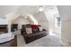 Cozy bonus room featuring a comfortable seating arrangement and ample natural light at 2804 Pulaski Dr, Monroe, NC 28110