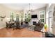 Inviting living room with fireplace, tile floors, and lots of natural light from surrounding windows at 2804 Pulaski Dr, Monroe, NC 28110