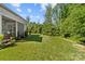 Lush backyard with manicured lawn and landscaping at 3615 Alamito Ln, Charlotte, NC 28214