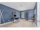 Bedroom with blue walls, carpet, a desk, and a window with natural light at 3615 Alamito Ln, Charlotte, NC 28214