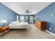 Primary bedroom featuring blue walls, carpet, and many windows providing natural light at 3615 Alamito Ln, Charlotte, NC 28214