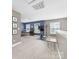 Spacious bonus room with neutral walls, carpet and an exercise bike area with a TV for entertainment at 3615 Alamito Ln, Charlotte, NC 28214
