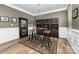 Dining room with stylish lighting, wood floors, and elegant decor at 3615 Alamito Ln, Charlotte, NC 28214
