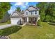 Charming two-story home with a well-maintained lawn and inviting front porch at 3615 Alamito Ln, Charlotte, NC 28214