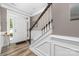 Elegant foyer with wood floors, stairs, and decorative trim at 3615 Alamito Ln, Charlotte, NC 28214